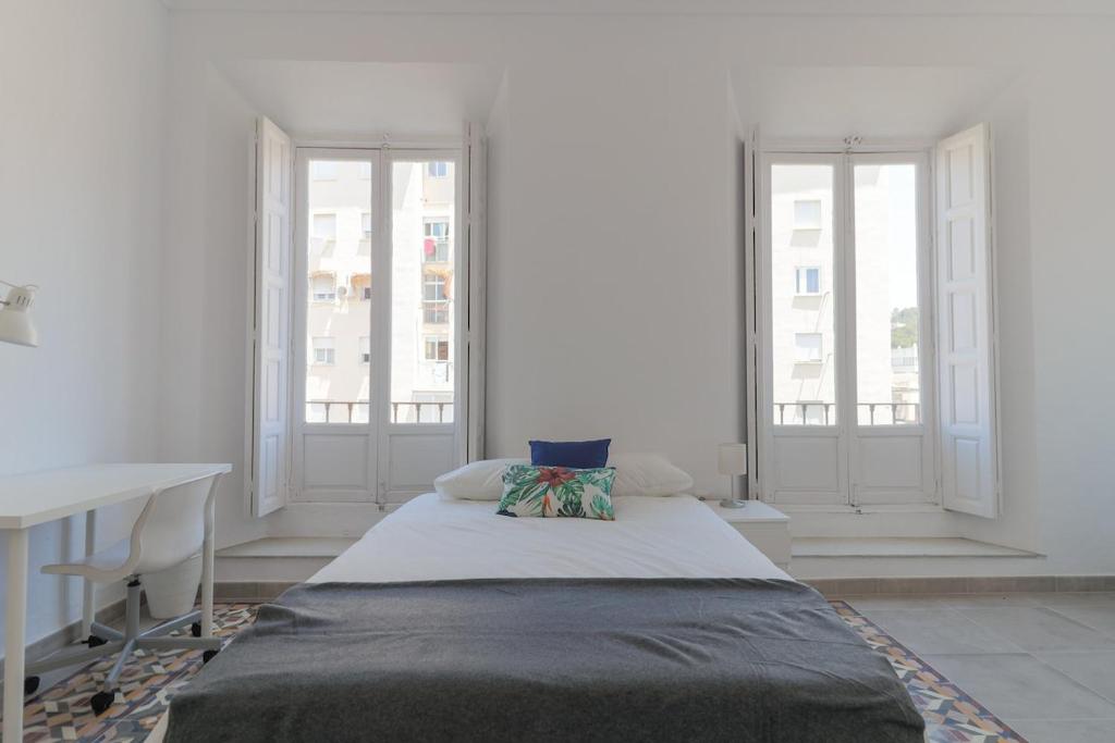 Posteľ alebo postele v izbe v ubytovaní C11 - Cosy 7 Bedrooms in Plaza Merced