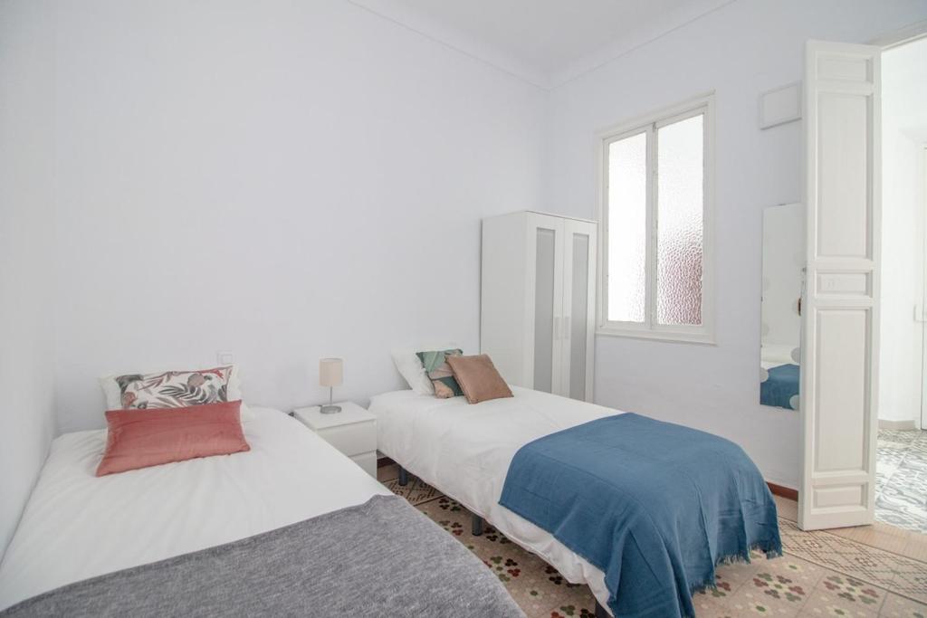Posteľ alebo postele v izbe v ubytovaní C11 - Cosy 7 Bedrooms in Plaza Merced