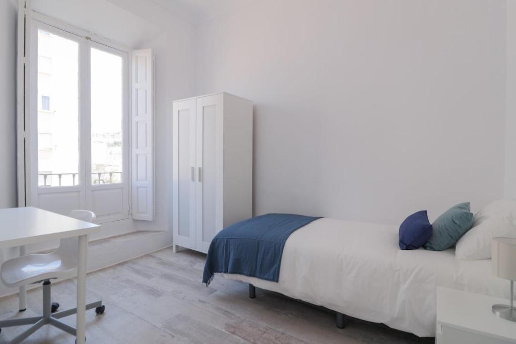 Posteľ alebo postele v izbe v ubytovaní C11 - Cosy 7 Bedrooms in Plaza Merced