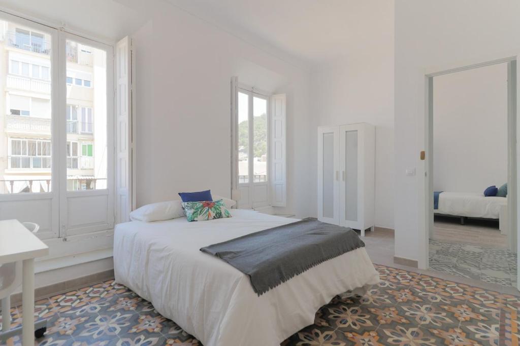 Posteľ alebo postele v izbe v ubytovaní C11 - Cosy 7 Bedrooms in Plaza Merced