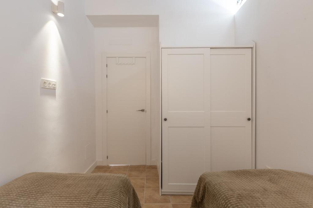 Postel nebo postele na pokoji v ubytování Precioso apartamento con patio y dos habitaciones en el barrio de Picasso