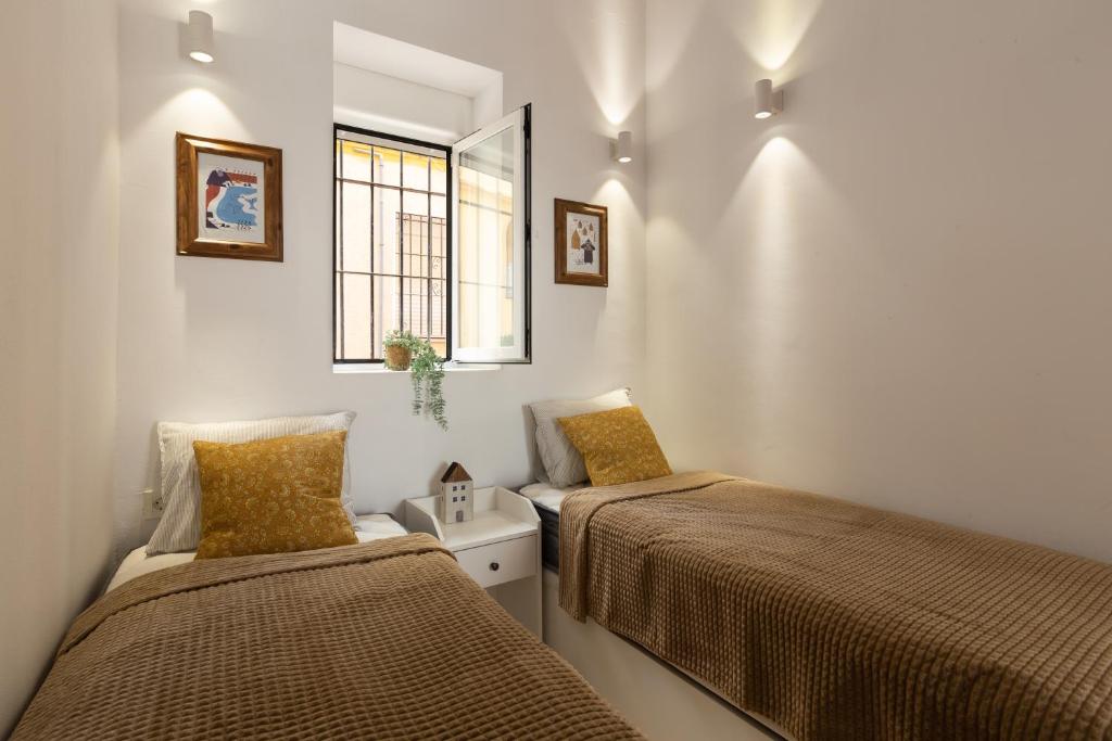 Postel nebo postele na pokoji v ubytování Precioso apartamento con patio y dos habitaciones en el barrio de Picasso