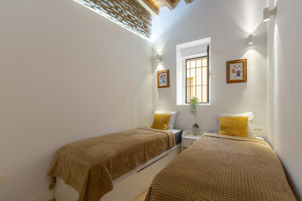 Postel nebo postele na pokoji v ubytování Precioso apartamento con patio y dos habitaciones en el barrio de Picasso