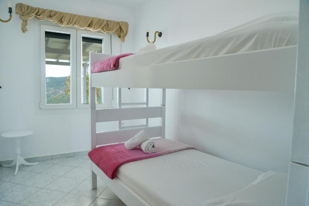 Postel nebo postele na pokoji v ubytování XALAKAS SUMMER HOUSE