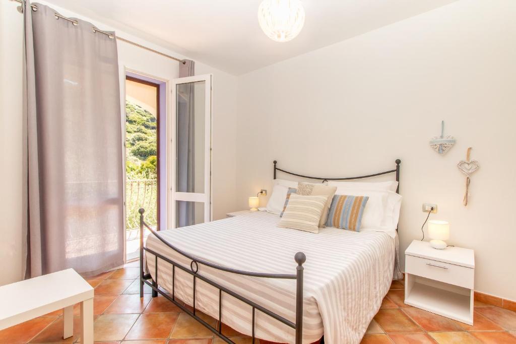 Postel nebo postele na pokoji v ubytování Residence L'Olivastro