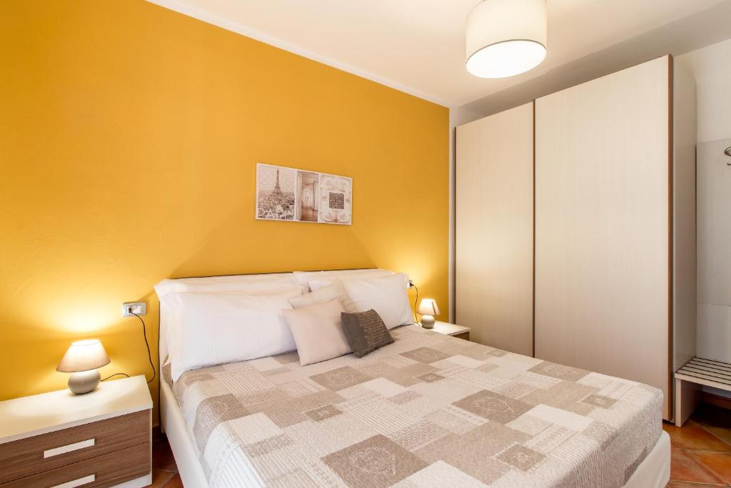 Postel nebo postele na pokoji v ubytování Residence L'Olivastro