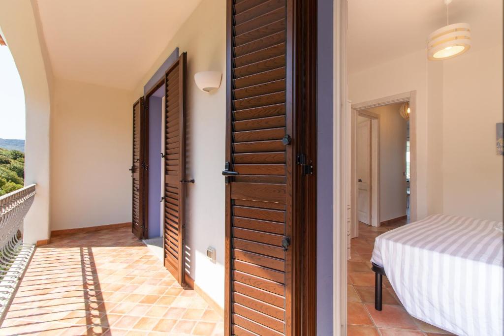 Postel nebo postele na pokoji v ubytování Residence L'Olivastro