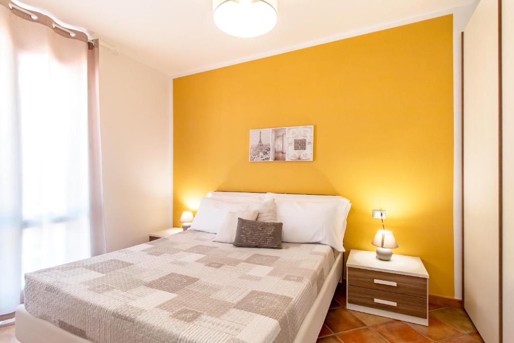 Postel nebo postele na pokoji v ubytování Residence L'Olivastro