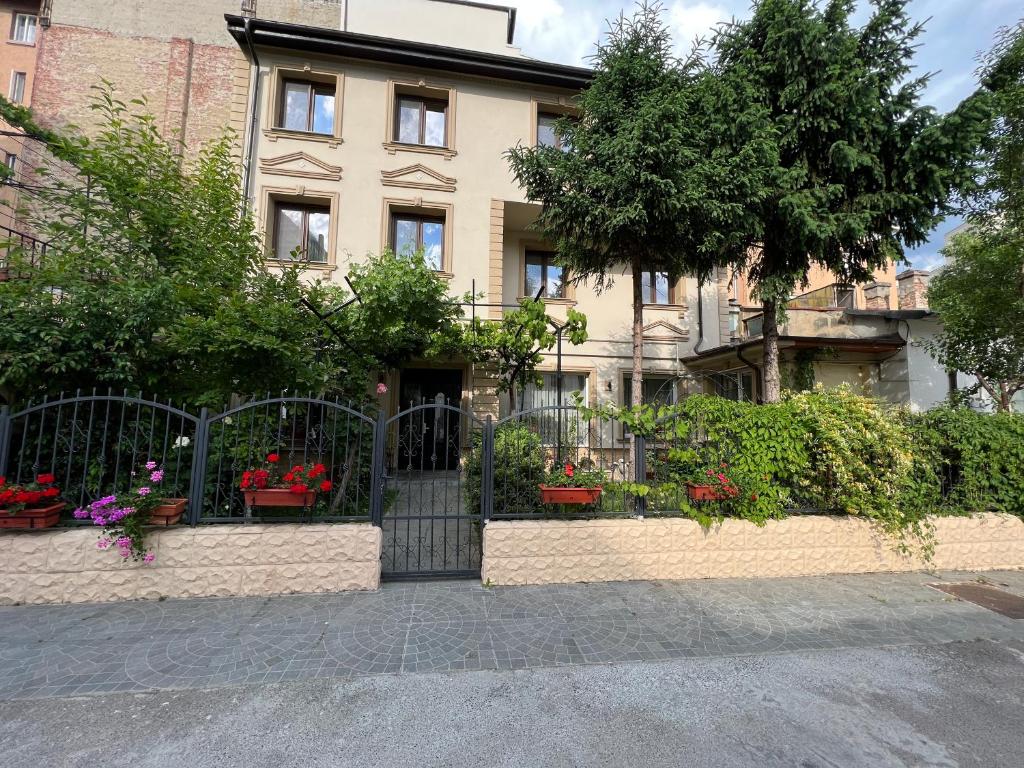 a building with a gate in front of it at Hotel Boutique Cathedral Plaza Residences room for rent downtown in Bucharest