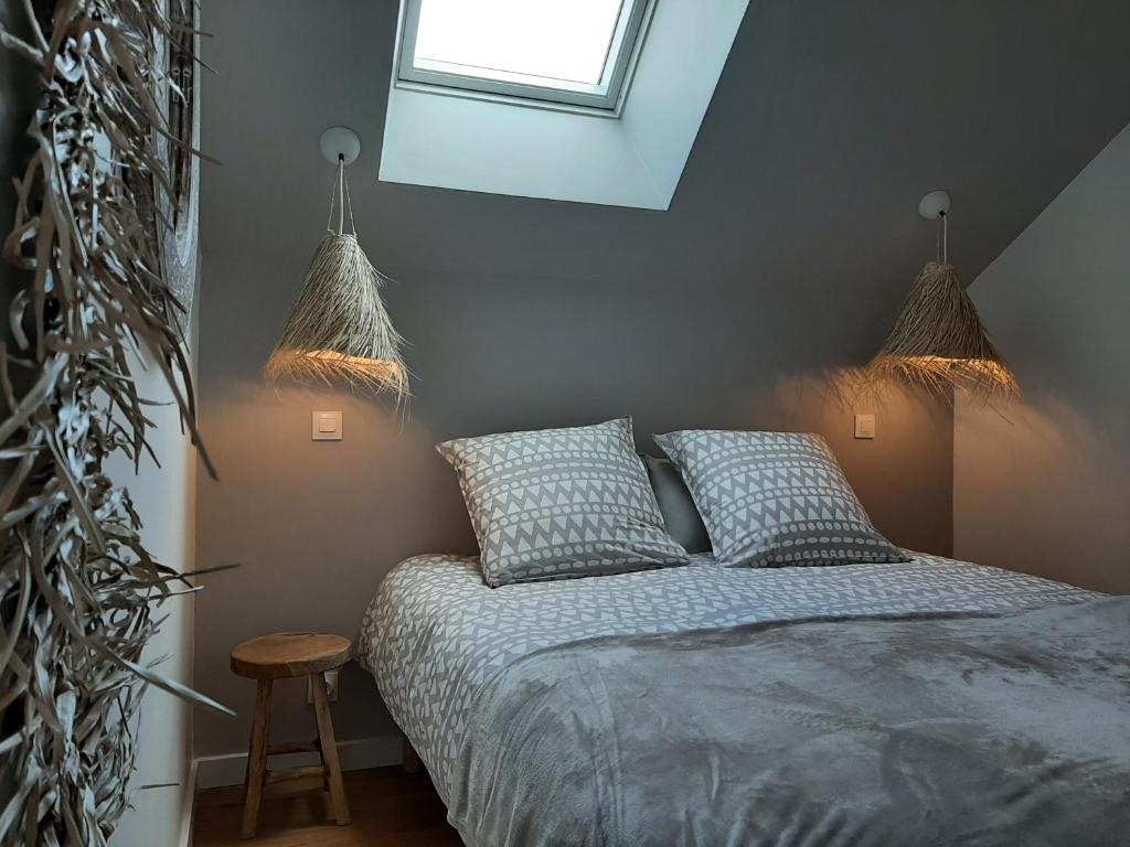 Posteľ alebo postele v izbe v ubytovaní Le Cottage du Bois Flotté
