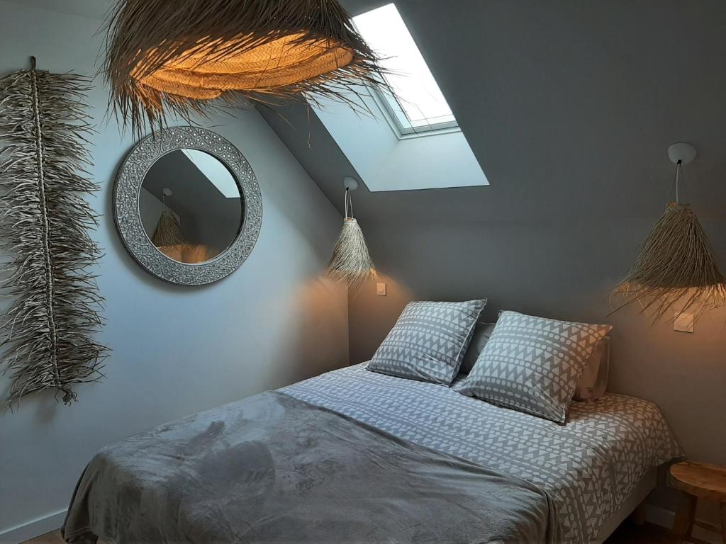 Posteľ alebo postele v izbe v ubytovaní Le Cottage du Bois Flotté