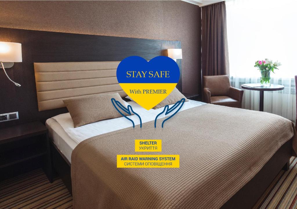 Кровать или кровати в номере Premier Hotel Rus