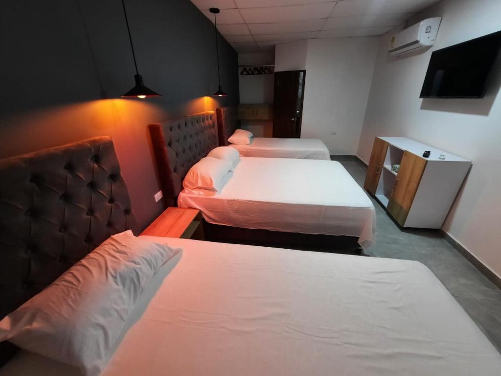 Postel nebo postele na pokoji v ubytování Hotel Almalu