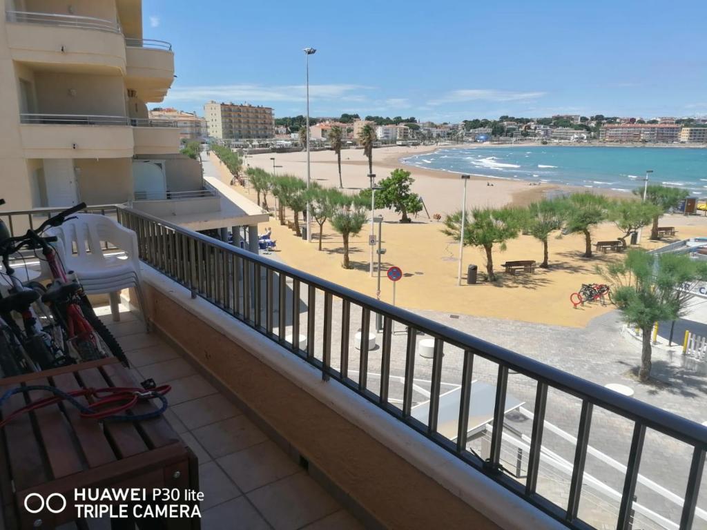 a balcony of a hotel with a view of the beach at Riells playa in L'Escala