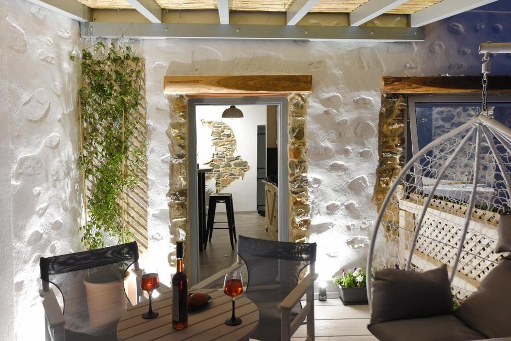 a living room with a couch and a mirror at Tramuntana in Ano Syros