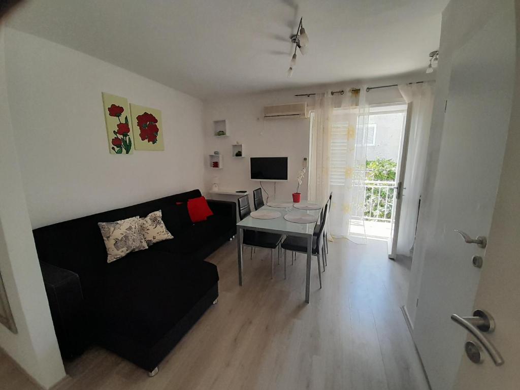 Televízia a/alebo spoločenská miestnosť v ubytovaní Apartment Roky