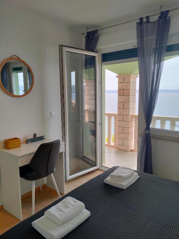 Postel nebo postele na pokoji v ubytování Apartments Blueness