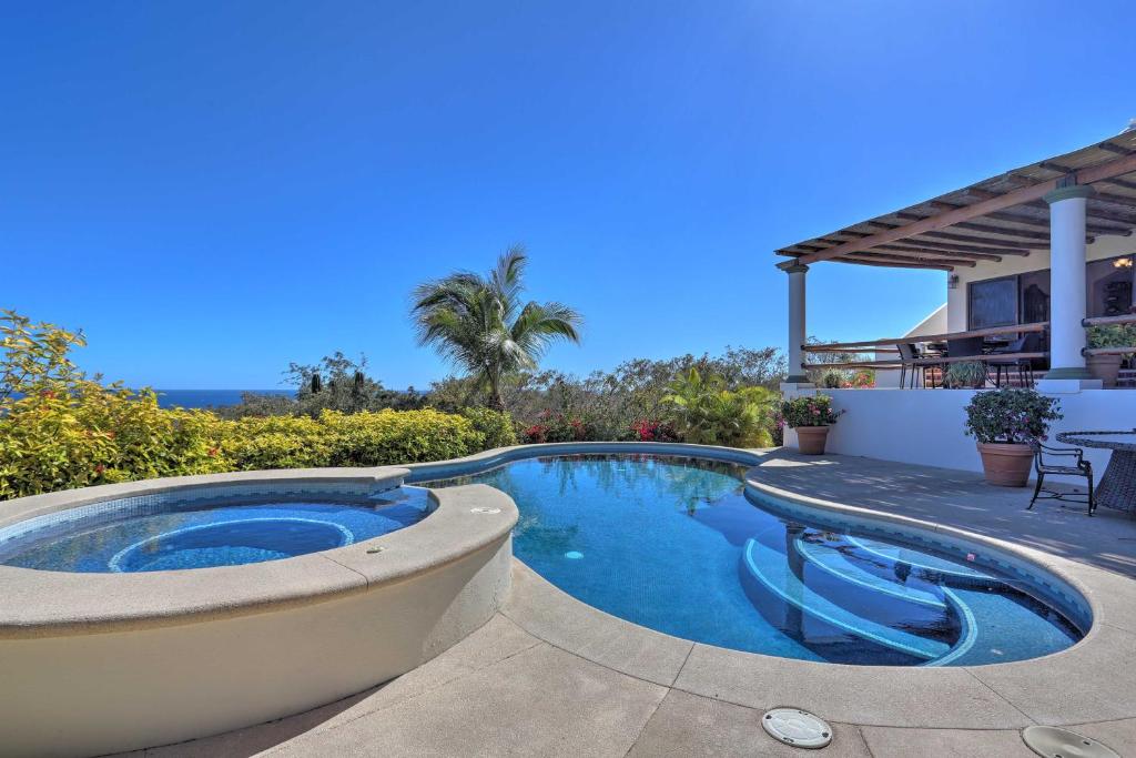 a swimming pool in a yard with a house at Lavish Cabo Resort Retreat with Pool Near the Beach! in Cabo San Lucas