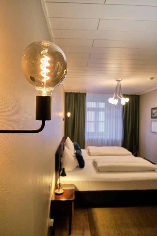 Postel nebo postele na pokoji v ubytování Hotel Roter Hahn