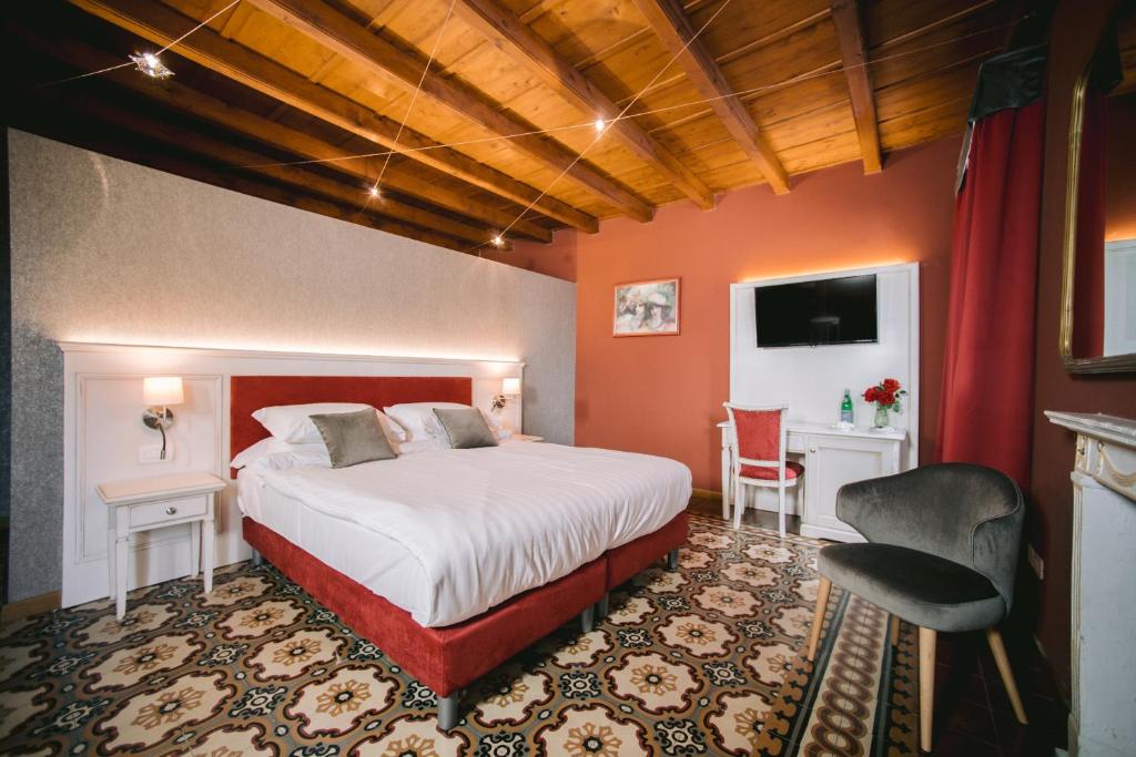 Postel nebo postele na pokoji v ubytování BACCO D'ORO Wine & Relais