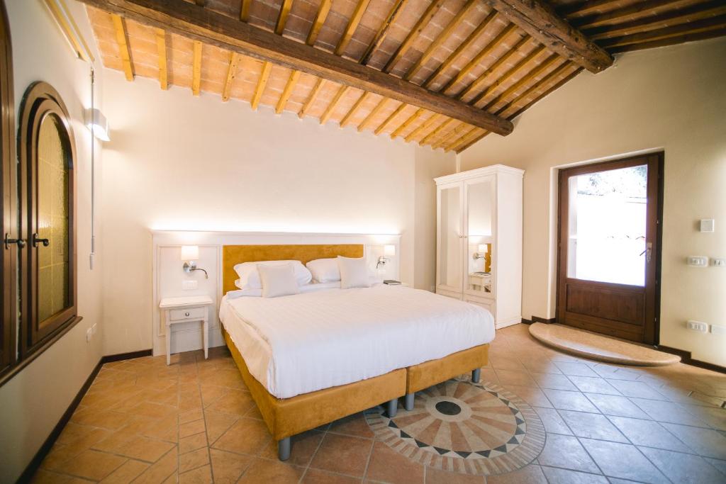 Postel nebo postele na pokoji v ubytování BACCO D'ORO Wine & Relais