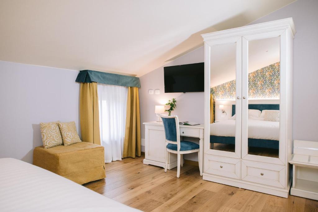 Postel nebo postele na pokoji v ubytování BACCO D'ORO Wine & Relais