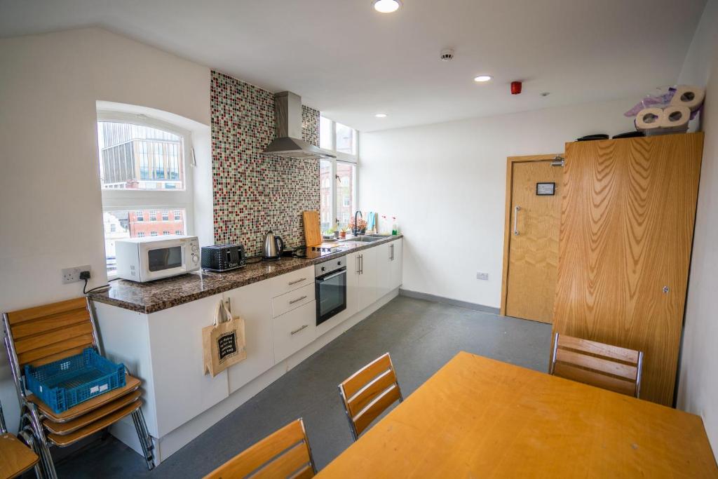 Kuchyň nebo kuchyňský kout v ubytování Apartment Chinatown 303