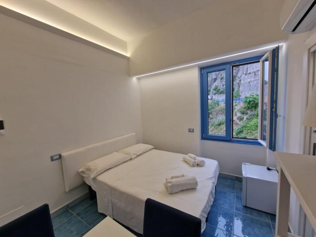 Posteľ alebo postele v izbe v ubytovaní B&B Acquamarine