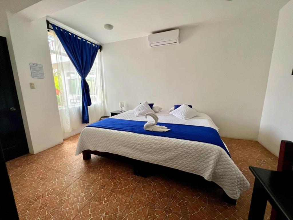 Postel nebo postele na pokoji v ubytování Hotel Cally