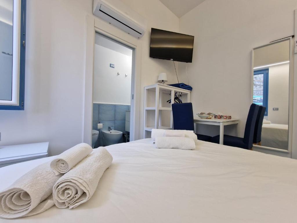Posteľ alebo postele v izbe v ubytovaní B&B Acquamarine