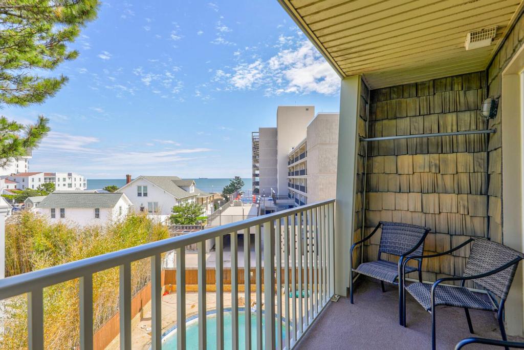 a balcony with two chairs and a view at Rehoboth Beach -- The Crest #303 in Rehoboth Beach