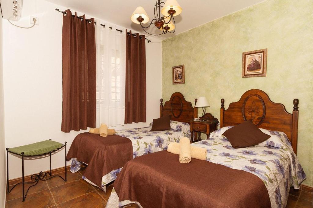 Posteľ alebo postele v izbe v ubytovaní Villa Triana