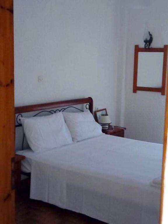 Postel nebo postele na pokoji v ubytování Kassandra Garden Residence