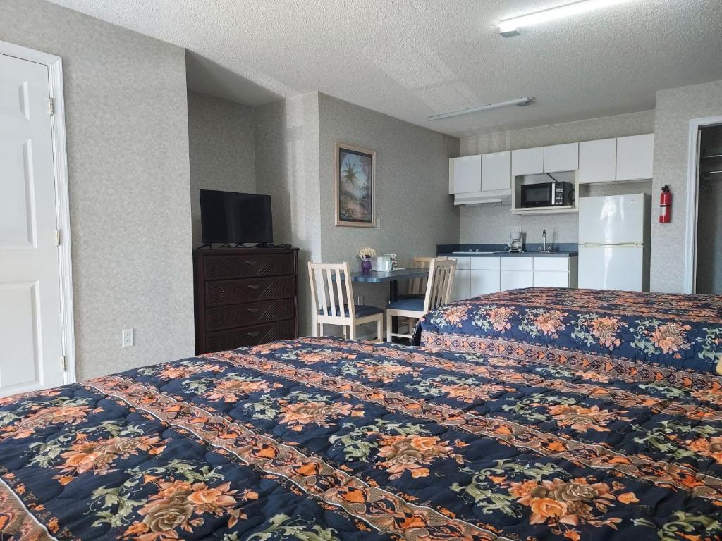 Kuchyň nebo kuchyňský kout v ubytování Studio Inn and Suites
