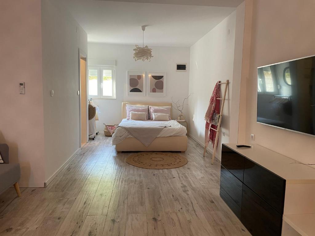 Posteľ alebo postele v izbe v ubytovaní Apartman David 73