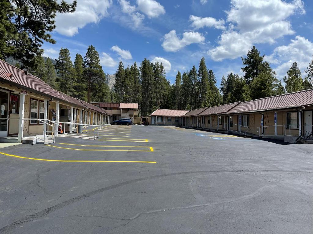 an empty parking lot in front of a building at Pinewood Inn in South Lake Tahoe