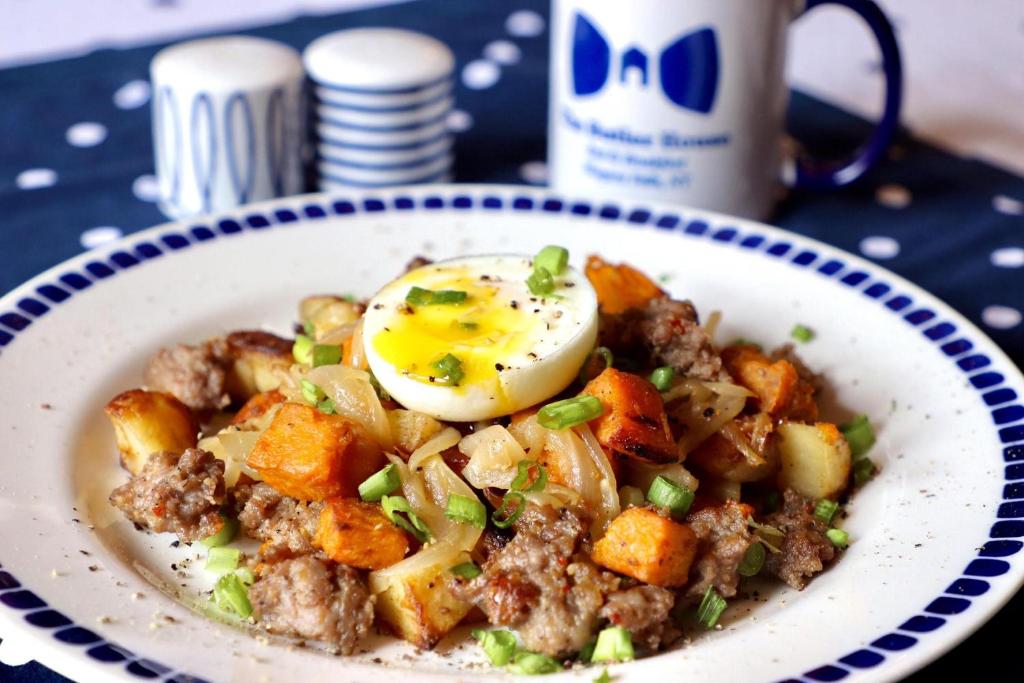 a bowl of food with an egg on top at The Butler House Bed & Breakfast in Niagara Falls