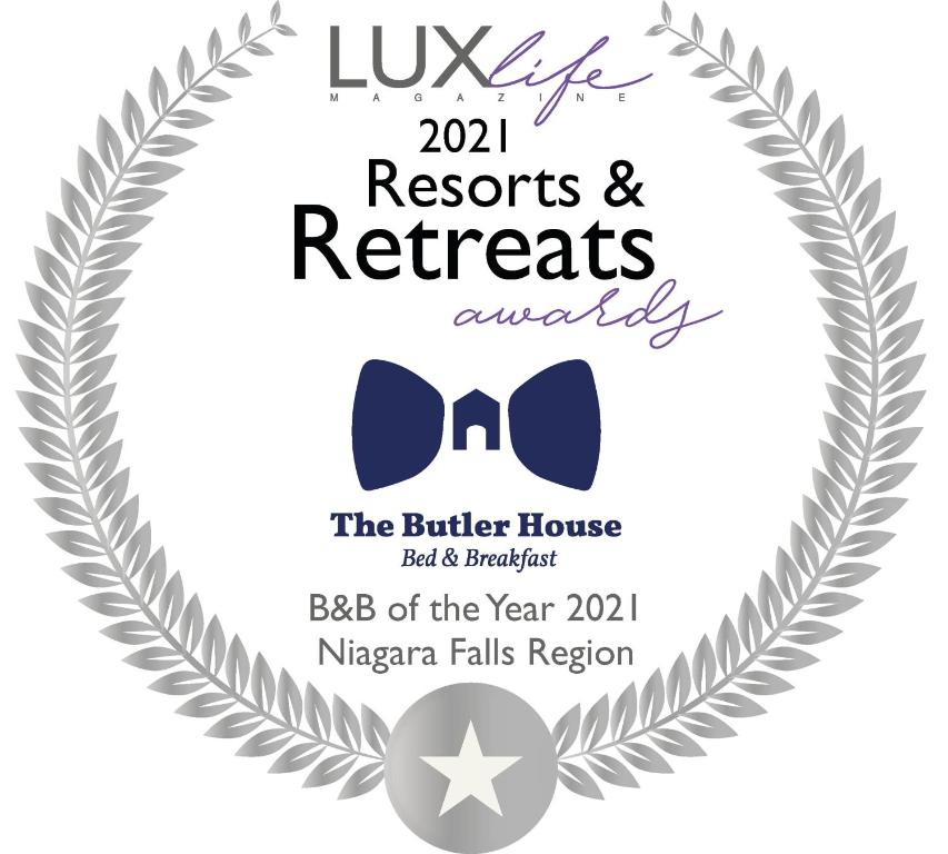 a silver laurel wreathreath frame with a bow tie on a graduation invitation at The Butler House Bed & Breakfast in Niagara Falls