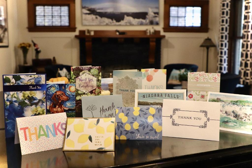 a table topped with lots of different types of cards at The Butler House Bed & Breakfast in Niagara Falls