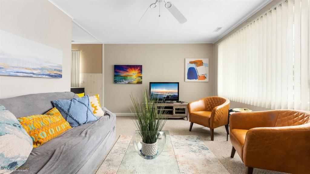 a living room with a couch and a tv at 204 E Syracuse Ave in Wildwood Crest