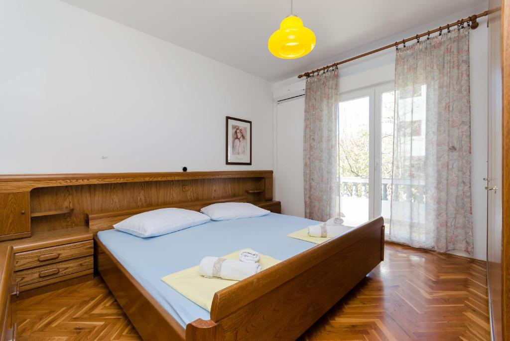 Posteľ alebo postele v izbe v ubytovaní Apartments Slavica R