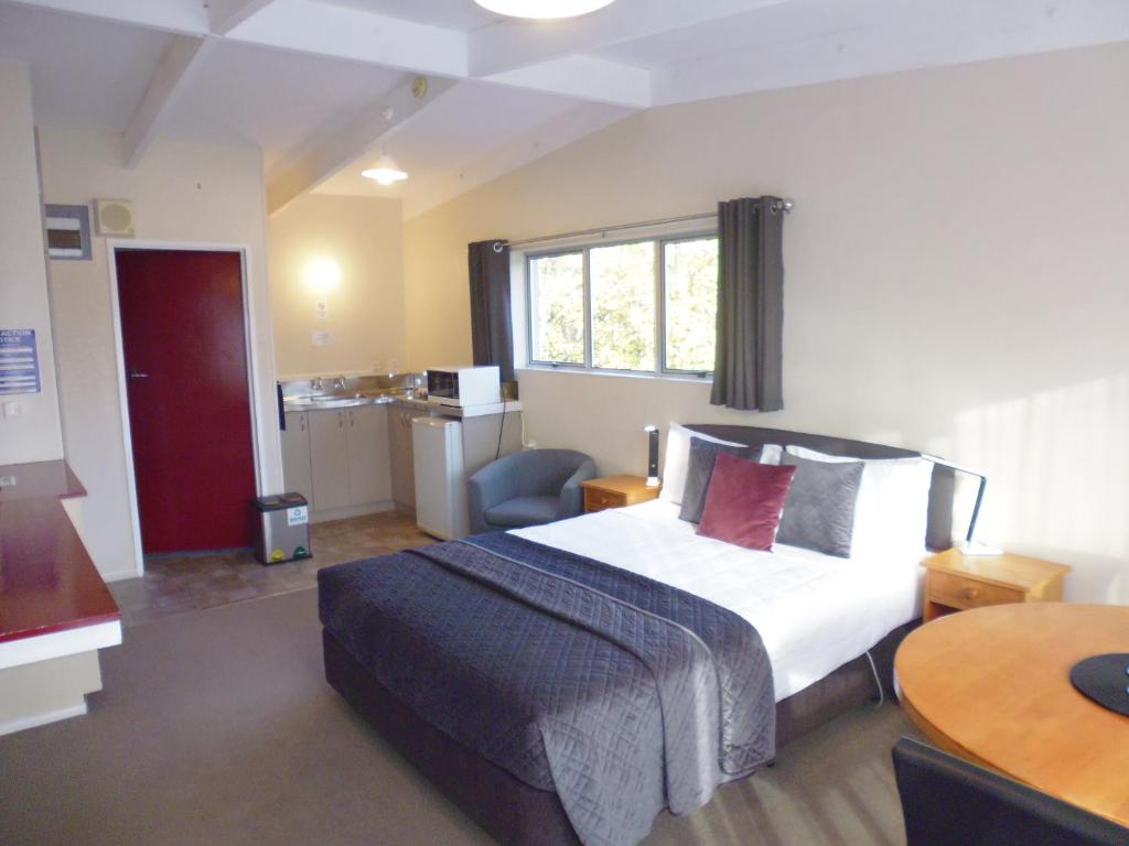 Postel nebo postele na pokoji v ubytování Spa Lodge Motel