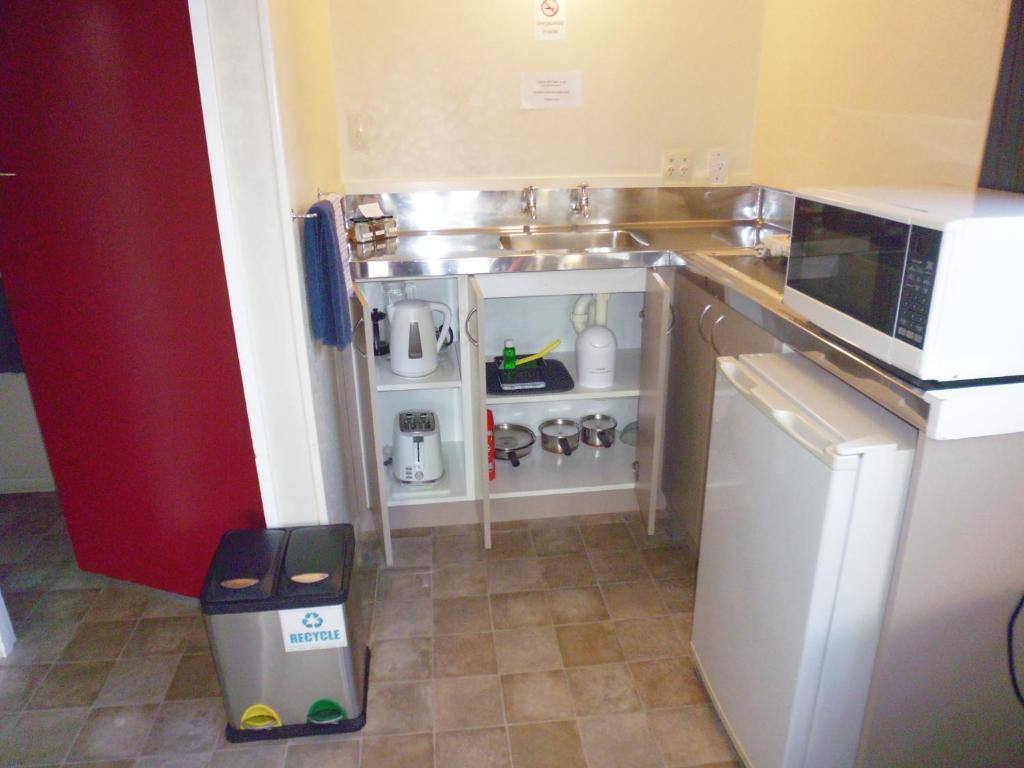Kuchyň nebo kuchyňský kout v ubytování Spa Lodge Motel
