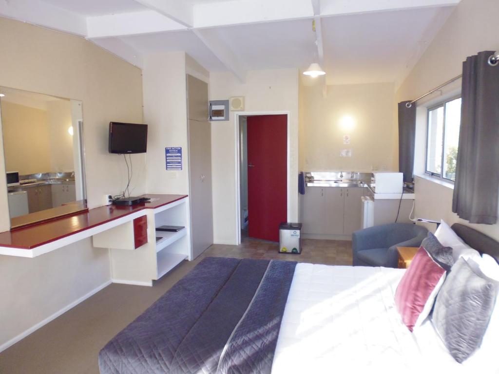 Postel nebo postele na pokoji v ubytování Spa Lodge Motel