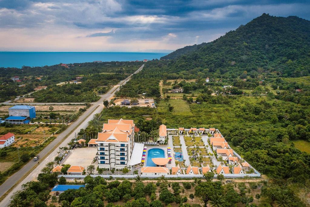 an aerial view of a resort with the ocean at Vakara Hotel Kep in Kep