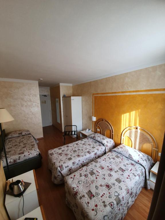 Postel nebo postele na pokoji v ubytování Hotel Le Pageot