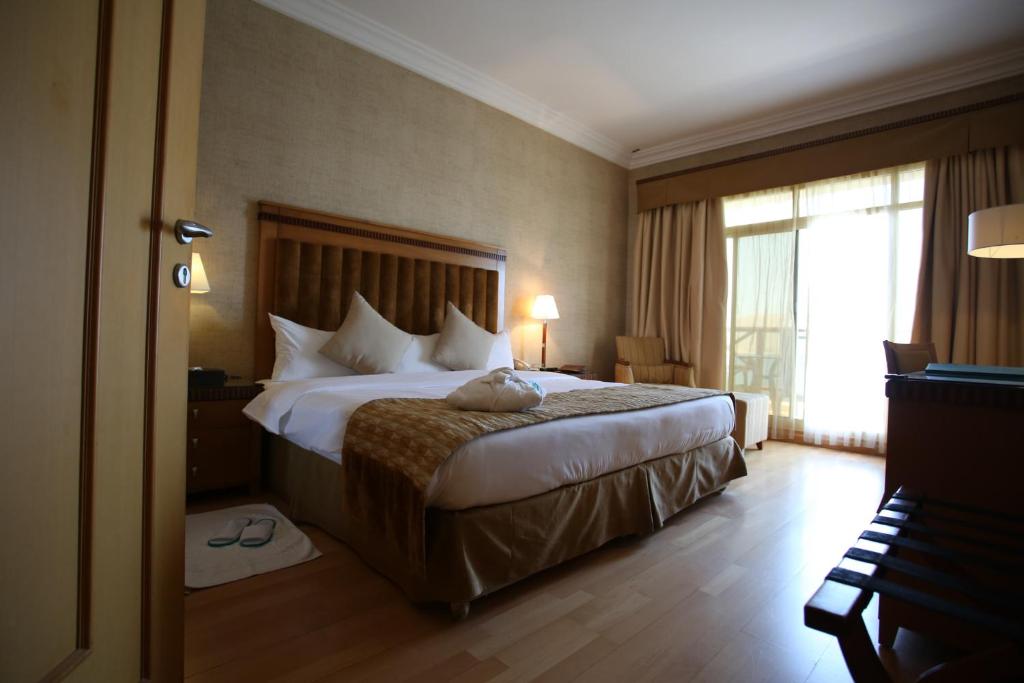 Postel nebo postele na pokoji v ubytování Atana Khasab Hotel