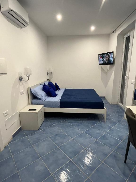 Postel nebo postele na pokoji v ubytování Relais Villa Ettore