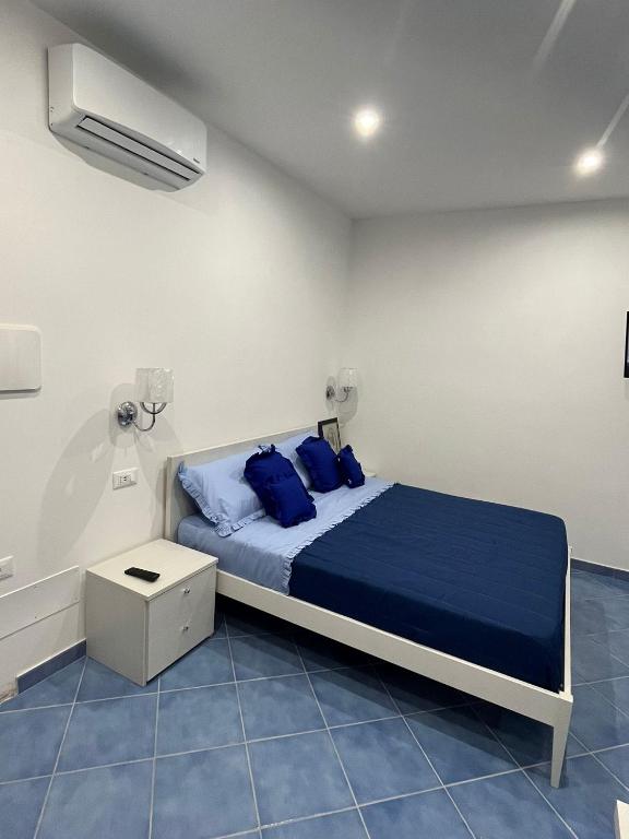 Postel nebo postele na pokoji v ubytování Relais Villa Ettore