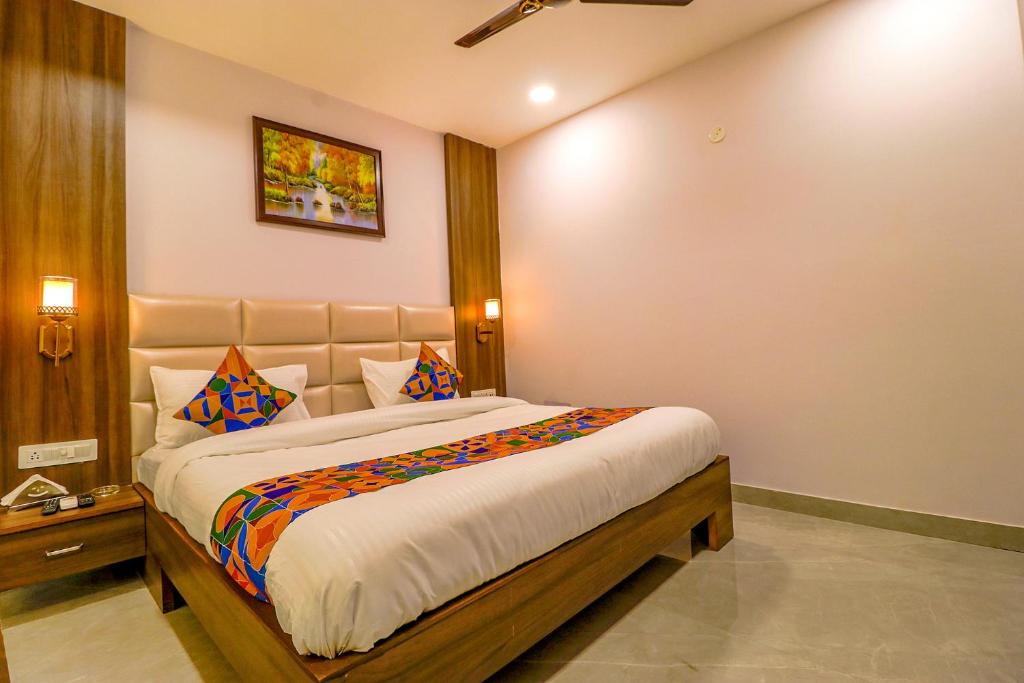 a bedroom with a large bed in a room at FabHotel Prime K9 Regency in Jalandhar